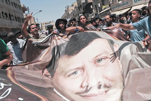 Protesters carrying a portrait of King Abdullah II, Amman, Jordan, July 15, 2011
