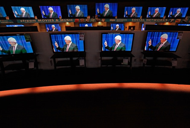 Dozens of televisions display a political ad showing Newt Gingrich, Urbandale, Iowa, December 27, 2011 
