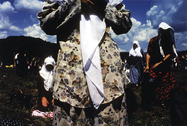Widows praying during the dedication ceremonies for a planned memorial to the more than eight thousand Bosnian Muslim men and boys who were massacred in July 1995, during the Bosnian war, by Serb forces in Srebrenica, July 11, 2001. The memorial was completed in 2003.