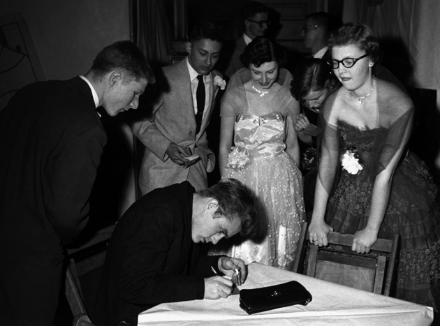 James Dean signing autographs during a Valentine’s Day dance at his old high school, Fairmount, Indiana, 1955
