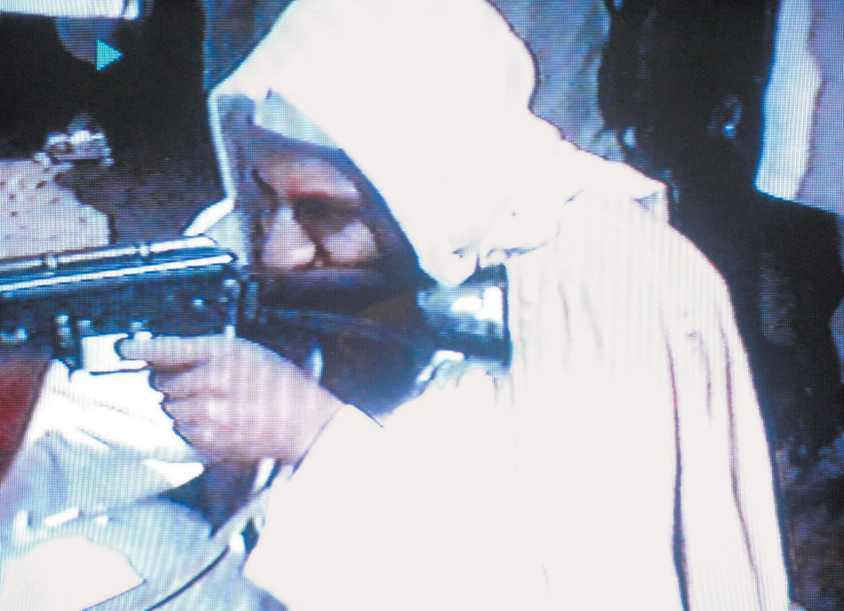 Osama bin Laden in a video reported to have been filmed at the al-Qaeda training camp al-Farouq, Afghanistan
