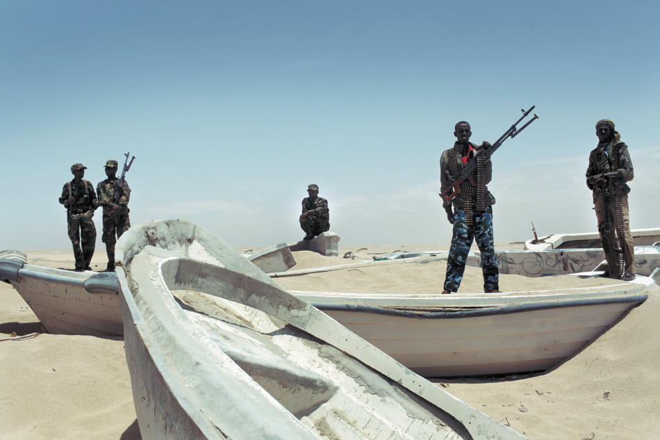 Pirate militiamen at a port in Hobyo, Somalia, August 2010
