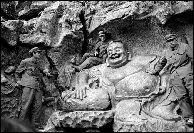 PLA soldiers on a Yuan Dynasty statue of a Maitraya, West Lake near Hangzhou, China, 1978
