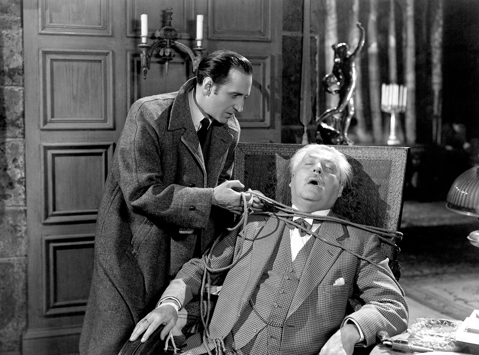 Basil Rathbone as Sherlock Holmes and Nigel Bruce as Dr. Watson in Sherlock Holmes and the House of Fear, 1945