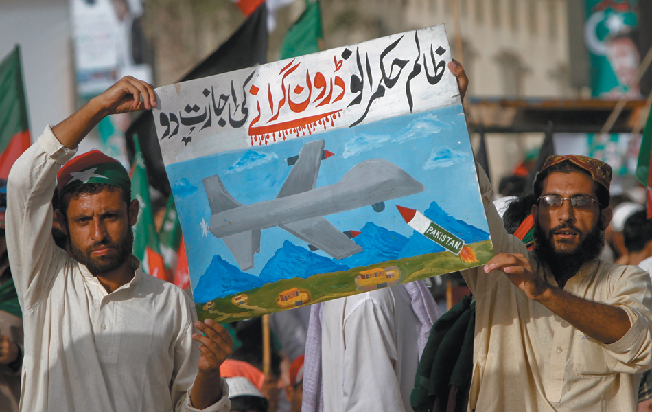 Protesters at a rally against drone attacks, Karachi, Pakistan, May 2011. Their sign says, in Urdu, ‘Oh cruel leaders, allow us to shoot down drones.’