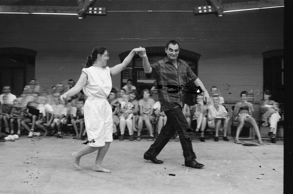 The artist Otto Mühl, dancing with a member of his Friedrichshof commune, June 1, 1989