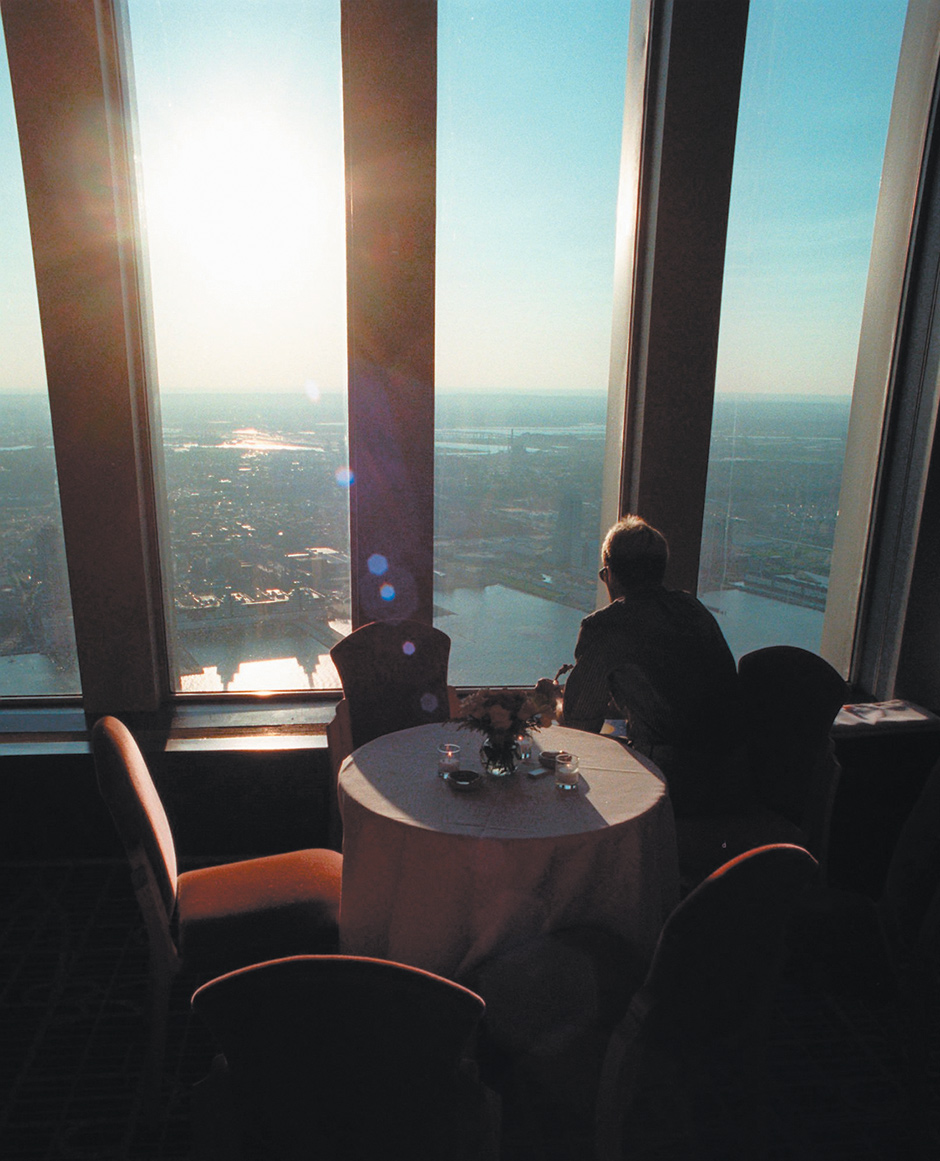 A diner looking across the Hudson River and New Jersey from Windows on the World, the restaurant at the top of the north tower of the World Trade Center, June 1996