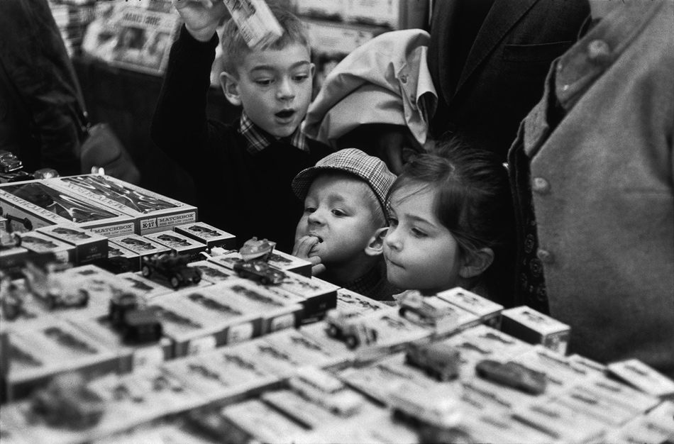Children buying toy cars, Paris, 1967; photograph by Henri Cartier-Bresson