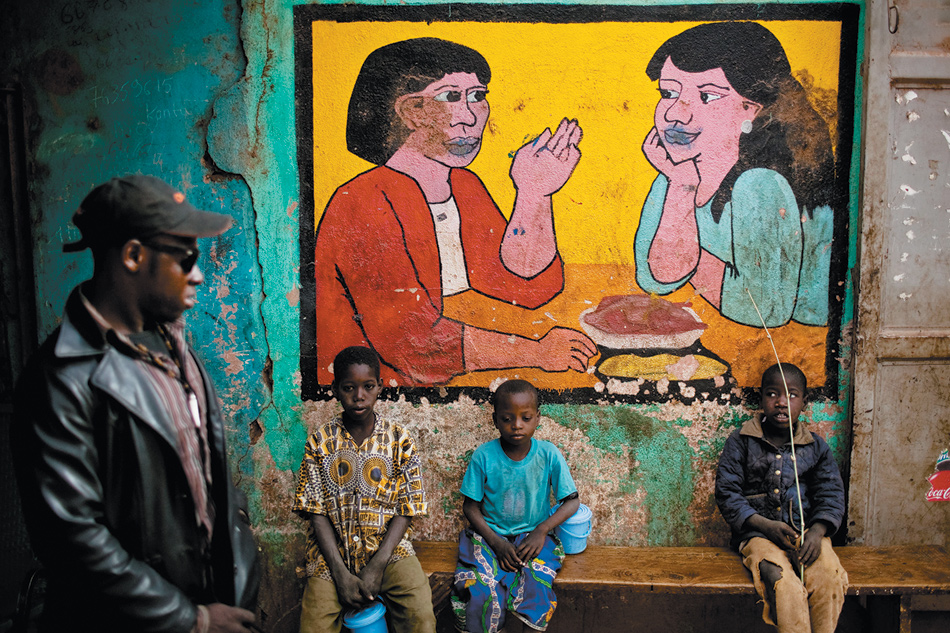 Residents outside a restaurant in Niono in central Mali, near the front line of fighting between Islamists and French and Malian forces, January 2013