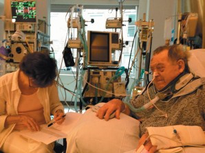 Arnold Relman in the surgical intensive care unit at Massachusetts General Hospital, the week after his accident. His wife, Marcia Angell, is helping him correct galleys of his August 15, 2013, article in these pages, “Obamacare: How It Should Be Fixed.”