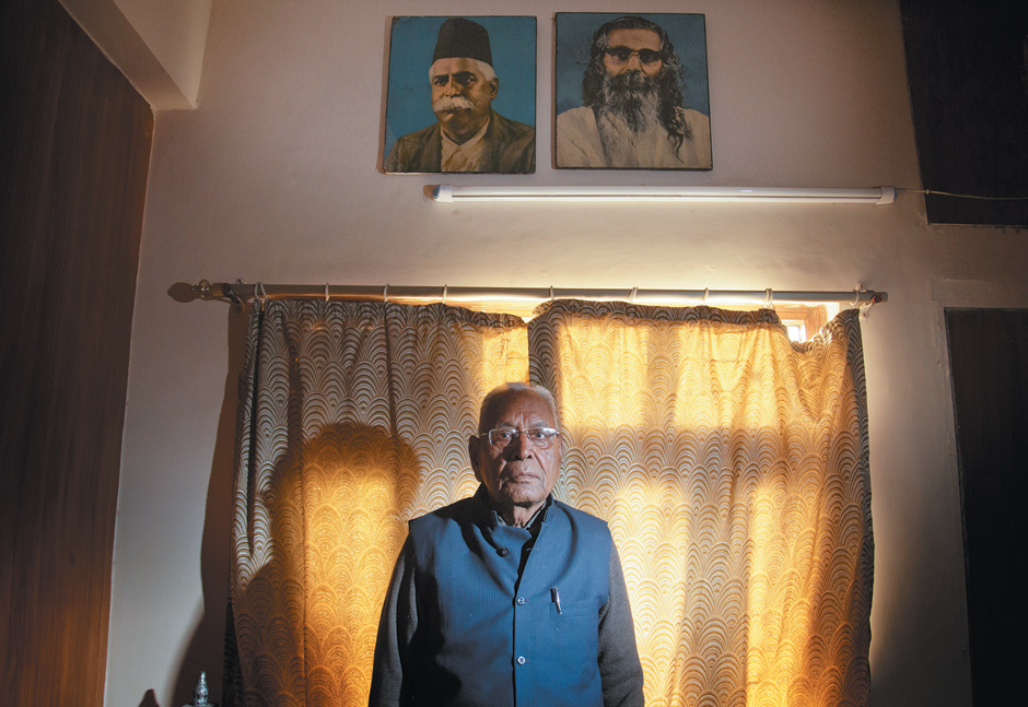 Dina Nath Batra, the retired headmaster whose lawsuit against Penguin India led the company to agree to destroy copies of Wendy Doniger’s book The Hindus: An Alternative History, in his office beneath portraits of right-wing Hindu nationalists K.B. Hedgewar and M.S. Golwakar, Delhi, February 2014
