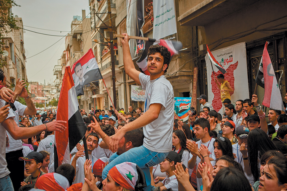 Supporters of Bashar al-Assad at a demonstration in Homs, May 2012