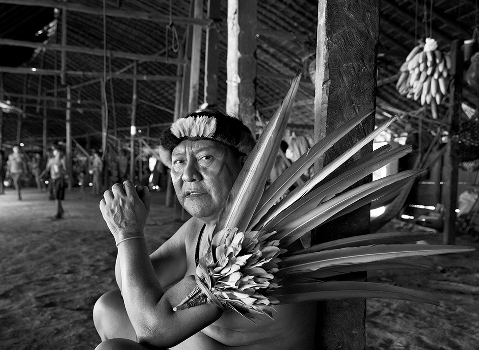 Shaman Davi Kopenawa in the Yanomami village of Demini, settled in the late 1970s near a FUNAI ­outpost that occupied a barracks from the abandoned Perimetral Norte road project, Yanomami territory, ­Roraima state, Brazil, April 2014; photographs by Sebastião Salgado, whose exhibition ‘Sebastião Salgado: Genesis’ is at the International Center of Photography, New York City, until January 11, 2015. The catalog is edited by Lélia Wanick Salgado and published by Taschen.