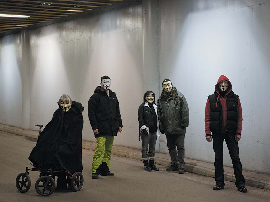People wearing Guy Fawkes masks to identify themselves as members of Anonymous, Stockholm, 2013
