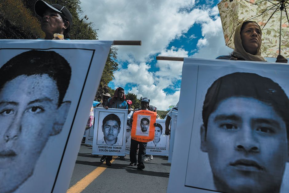 Demonstrators marching from the teachers’ college in Ayotzinapa to the center of Chilpancingo, the capital of Guerrero state, Mexico, to attend a memorial mass for the forty-three abducted students, October 2014