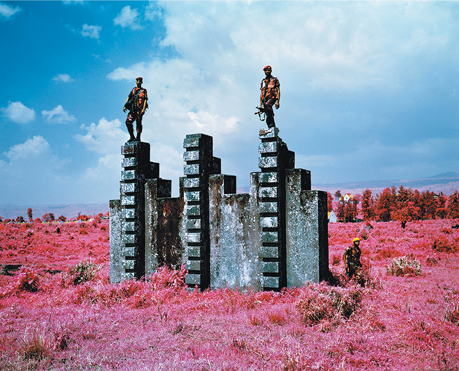 Richard Mosse: Triumph of the Will, 2011; infrared photograph of Congolese soldiers standing on a Belgian commando training structure at Rumangabo military base, North Kivu, eastern Congo