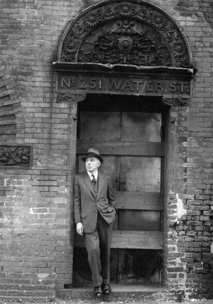 Joseph Mitchell in Lower Manhattan, near the old Fulton Fish Market; photograph by his wife, Therese Mitchell