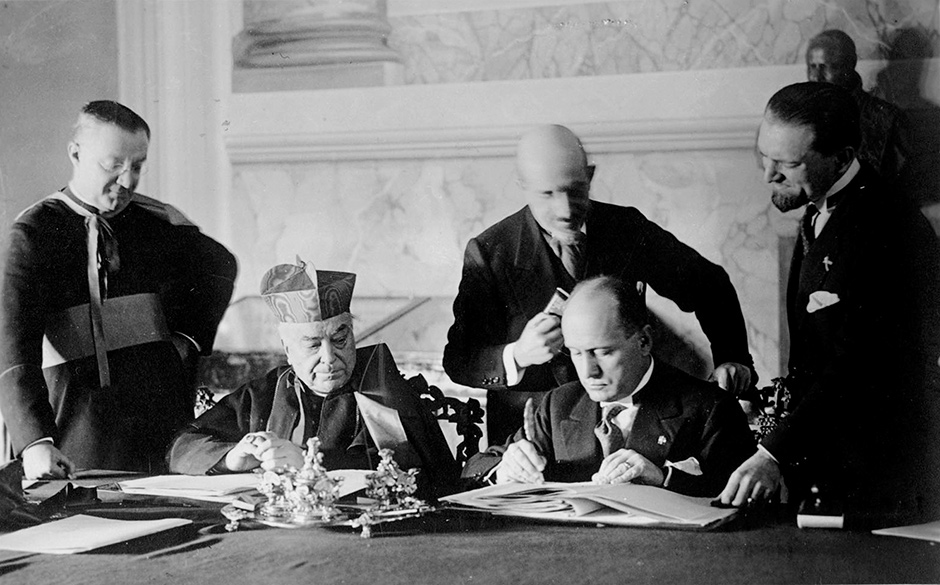 Monsignor Francesco Borgongini-Duca, Cardinal Pietro Gasparri, Francesco Pacelli, Benito Mussolini, and Dino Grandi at the signing of the Lateran Treaty between Italy and the Vatican, February 1929