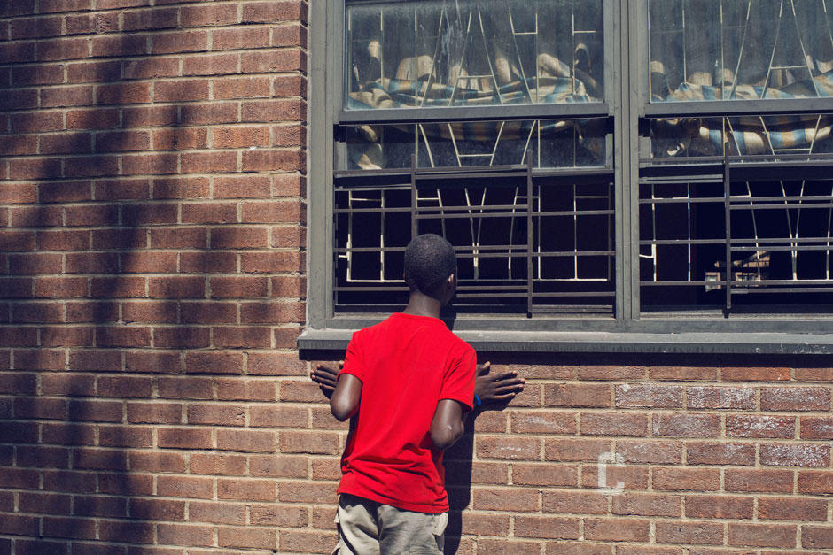 A boy looking into the Louis H. Pink housing project, Brooklyn, New York, 2012