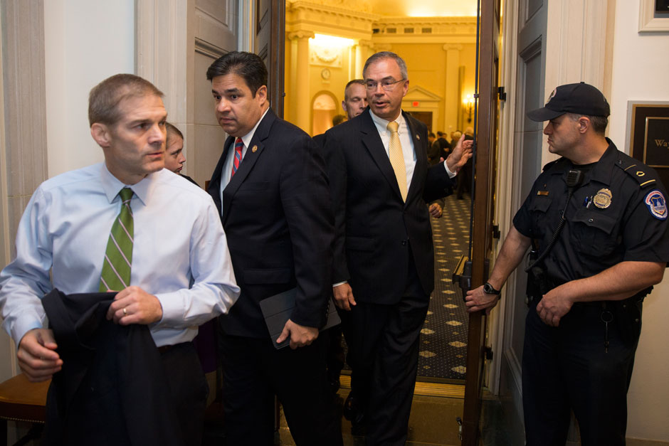 Representative Jim Jordan, Representative Raul Labrador, both Freedom Caucus members, and others, leave a hearing room on Capitol Hill after a nomination vote to replace House Speaker John Boehner fell apart, Washington, DC, October 8, 2015
