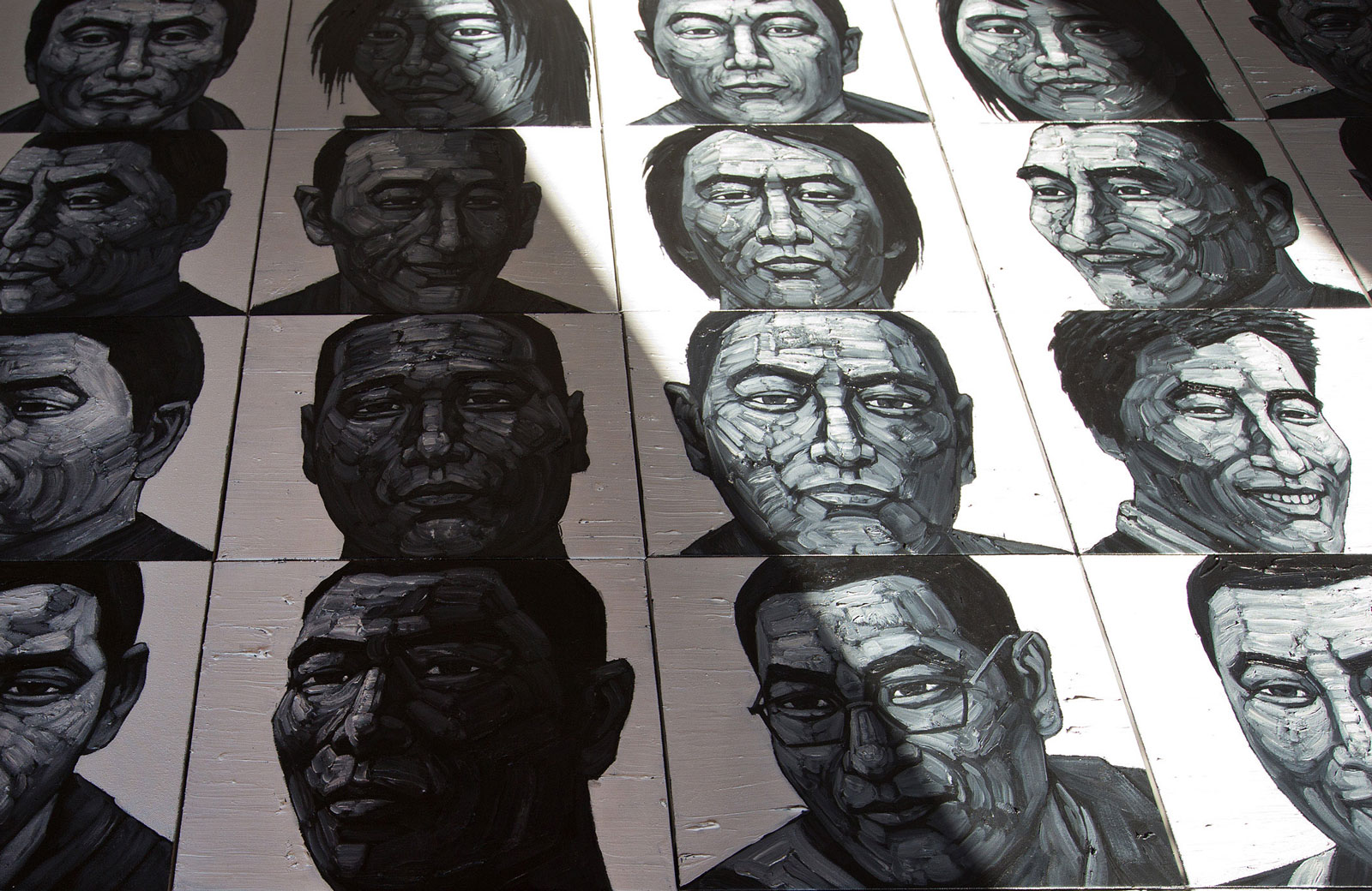 Liu Yi's portraits of Tibetans who have self-immolated, Songzhuang art village in Tongzhou, on the outskirt of Beijing, December 25, 2012