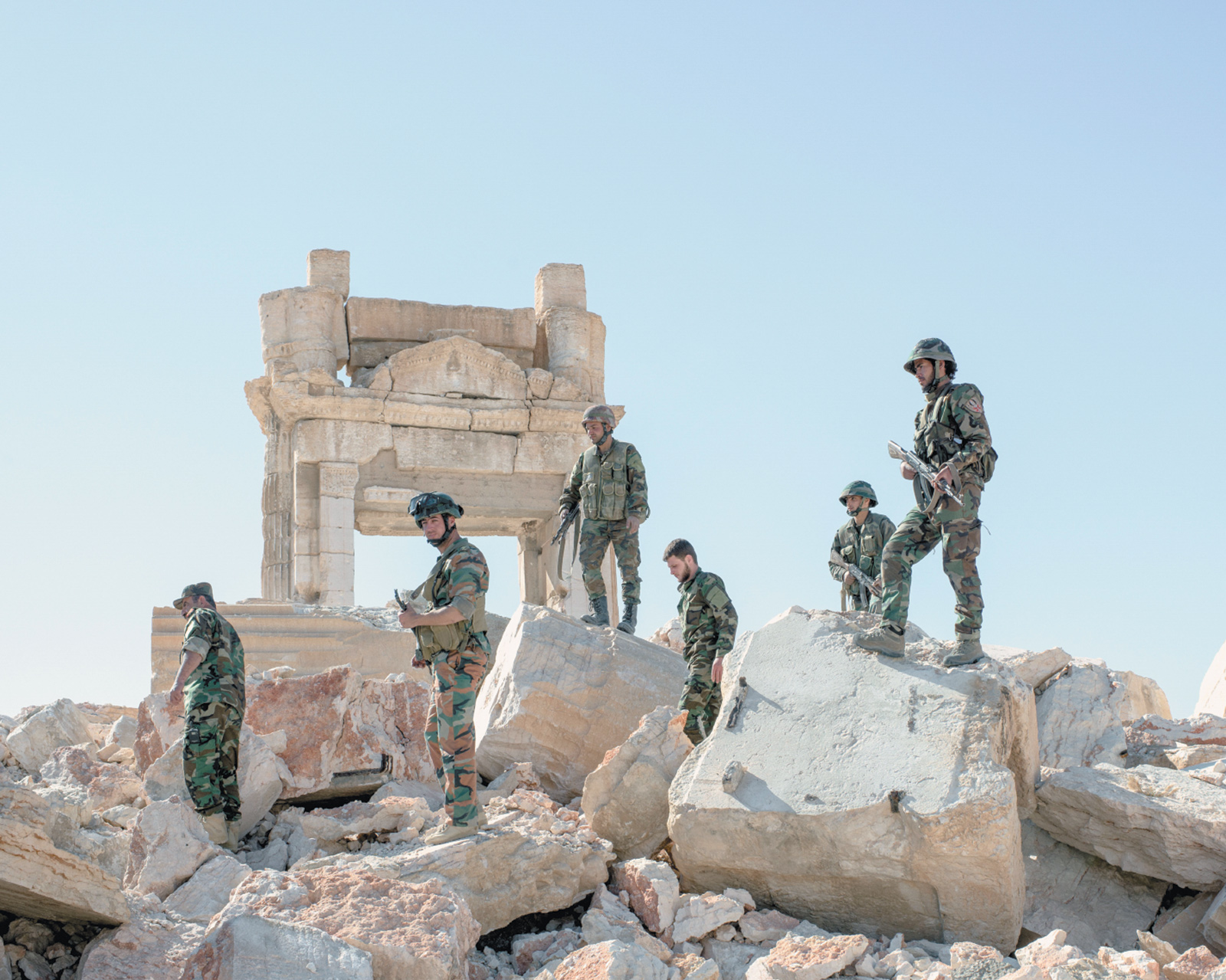 Syrian Army soldiers at the ruins of the destroyed Temple of Bel after retaking the ancient city of Palmyra from Islamic State militants, April 2016