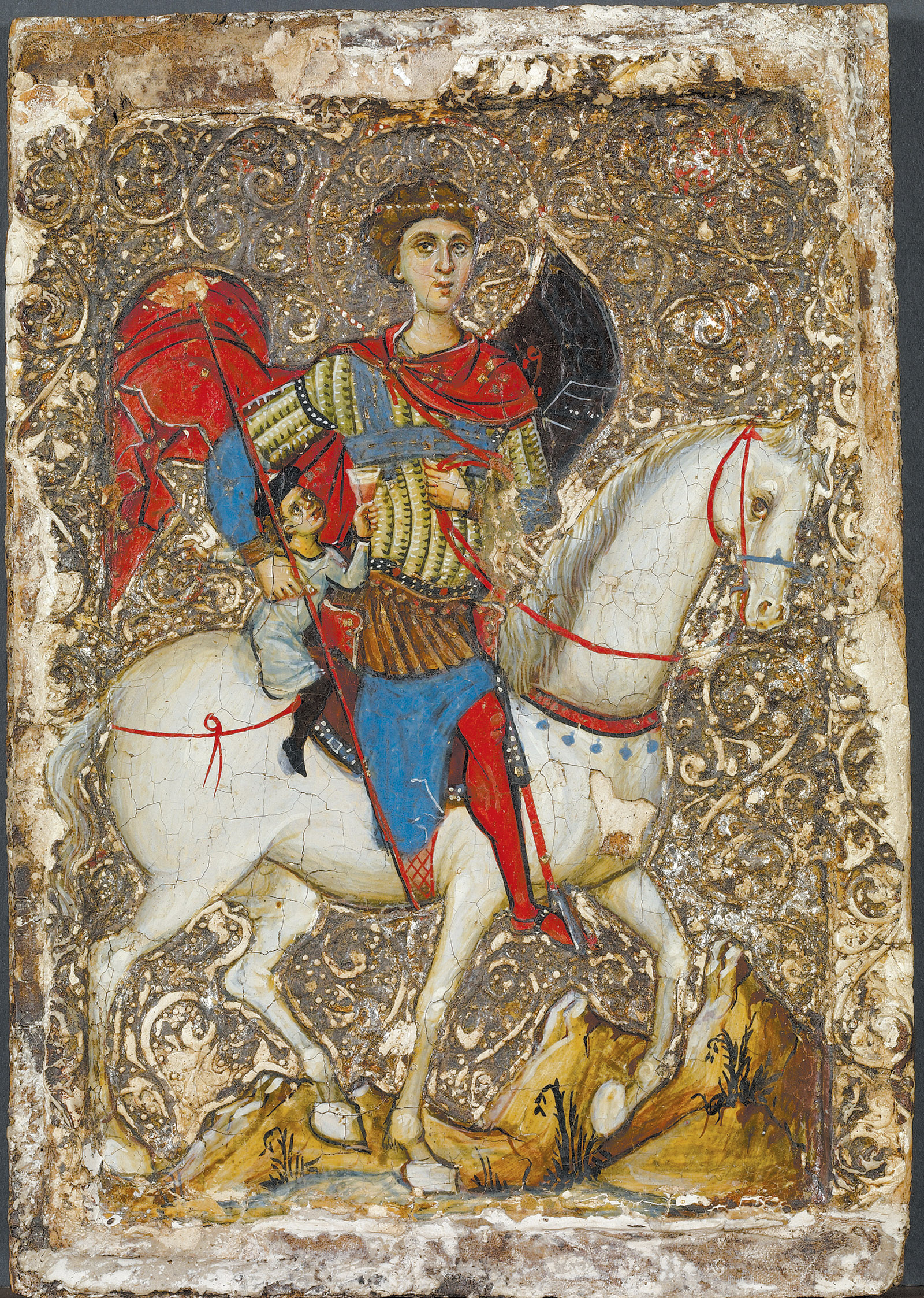 ‘Icon with Saint George and the Young Boy of Mytilene’; Holy Land, mid-thirteenth century. According to the ‘Jerusalem’ exhibition catalog, ‘The jug and wineglass held by the youth connect the image to a popular miracle account in which a boy captured by Saracens is made to serve as cupbearer for an amir and pressured to convert to Islam.’
