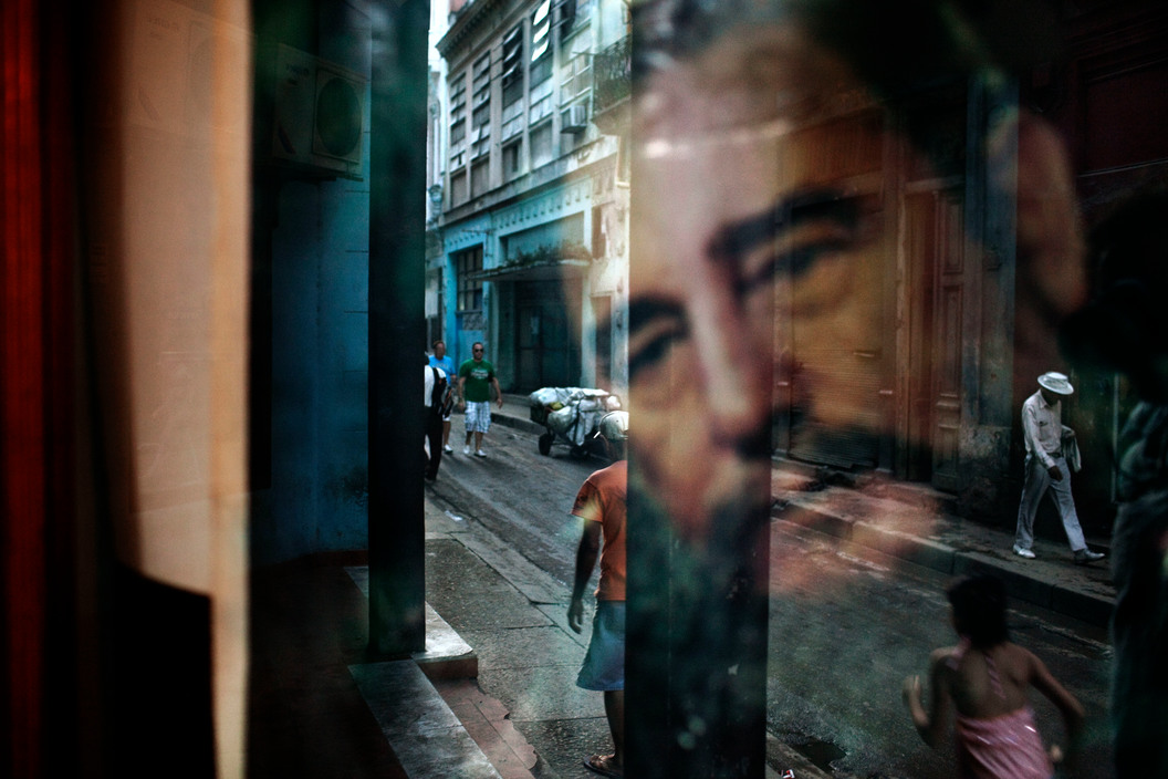 Reflection of Fidel Castro on a window in a working-class neighborhood, Havana, Cuba, 2012