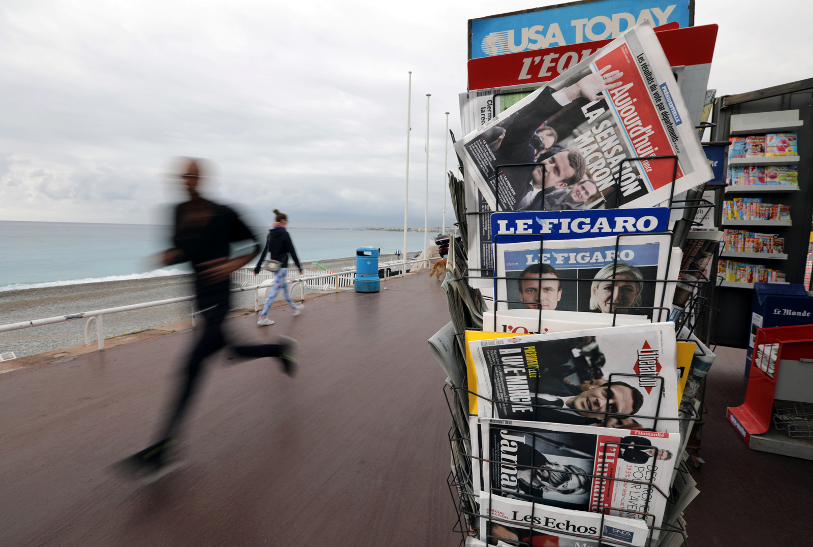 French newspapers with results from France's Presidential election on the Promenade Des Anglais in Nice, France, April 24, 2017 