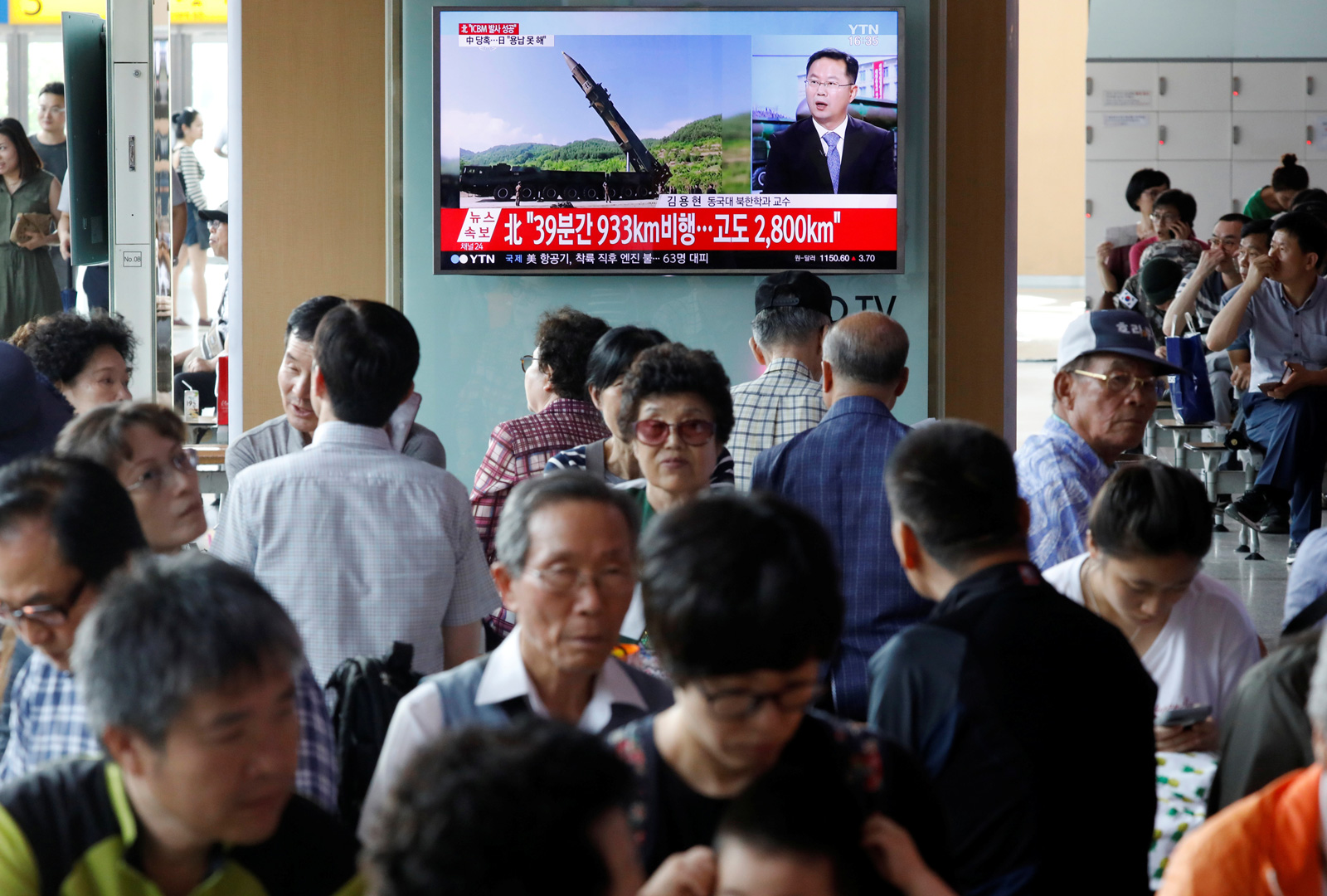 News of North Korea's intercontinental ballistic missile on a television screen at a railway station in Seoul, July 4, 2017