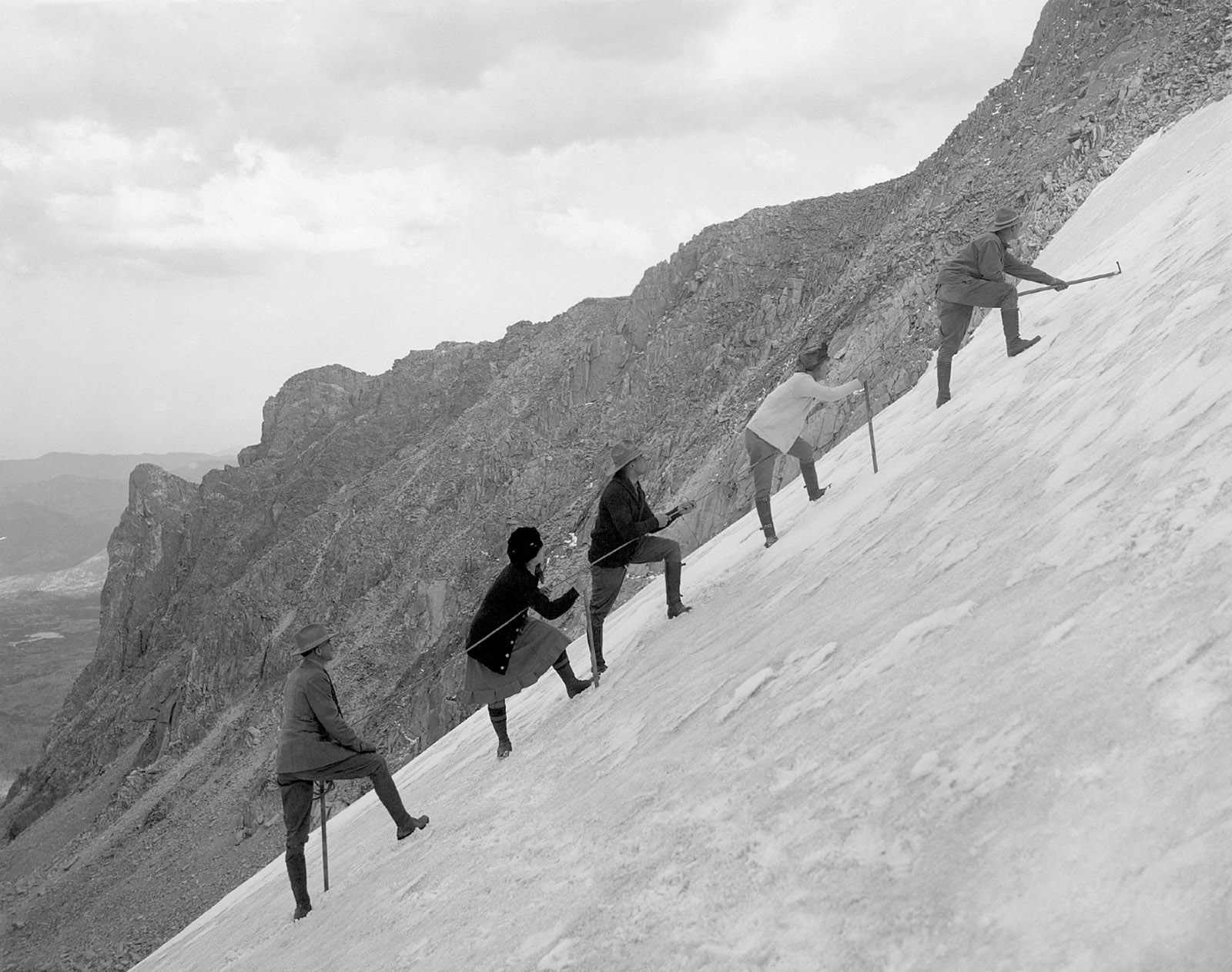 Hikers ascending Tyndall Glacier in Rocky Mountain National Park, Colorado, circa 1920