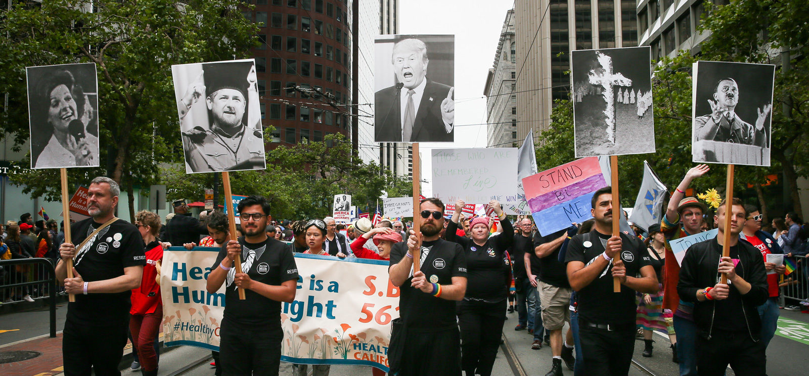 Marchers with photos of anti-gay activist Anita Bryant, Chechen President Ramzan Kadyrov, Donald Trump, the KKK, and Adolf Hitler at the Pride Parade, San Francisco, June 25, 2017