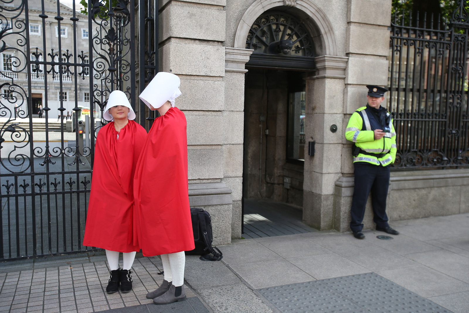 Reproductive rights activists, dressed as Handmaids from Margaret Atwood’s The Handmaid’s Tale, outside the Irish parliament before deliberation about the constitutional ban on abortion, September 18, 2017