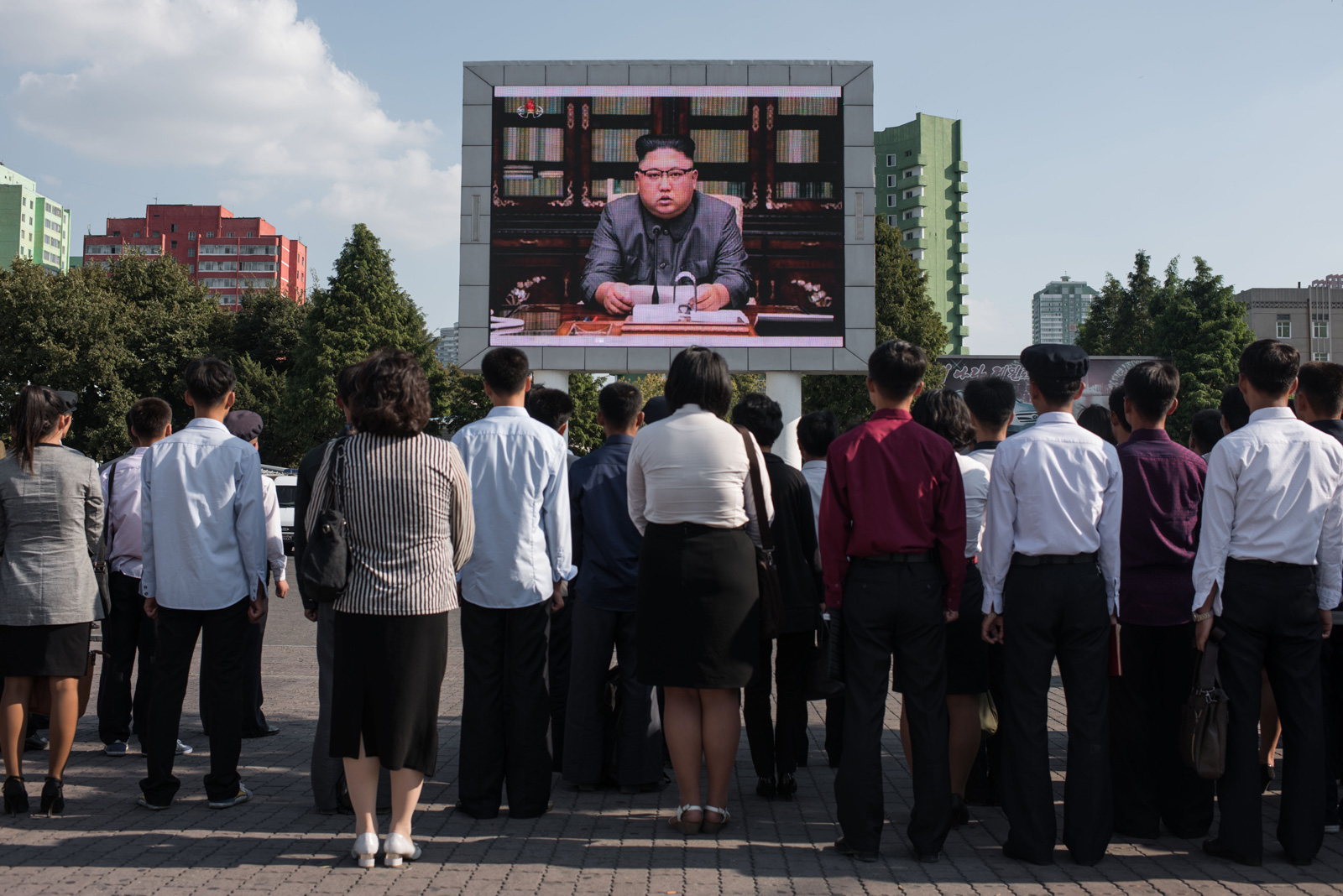 North Koreans watching a news broadcast of their leader, Kim Jong-un, speaking about the country’s nuclear program, Pyongyang, September 22, 2017