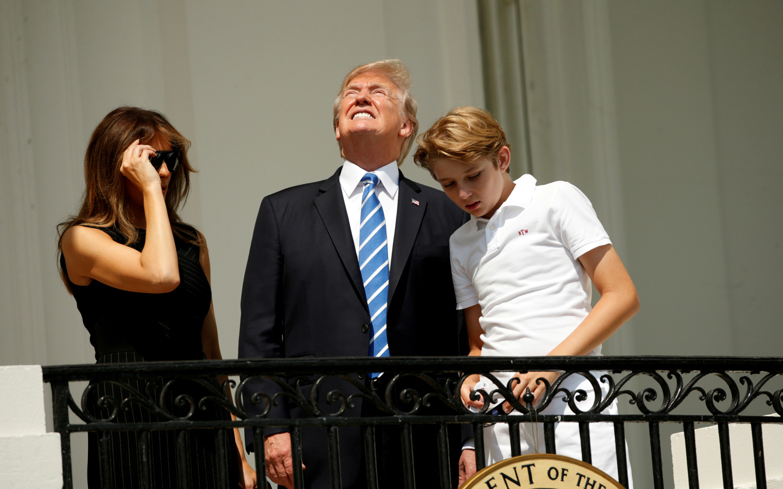 President Donald Trump looking at the solar eclipse without protective glasses, with his wife Melania and son Barron at the White House, Washington, D.C.,  August 21, 2017 