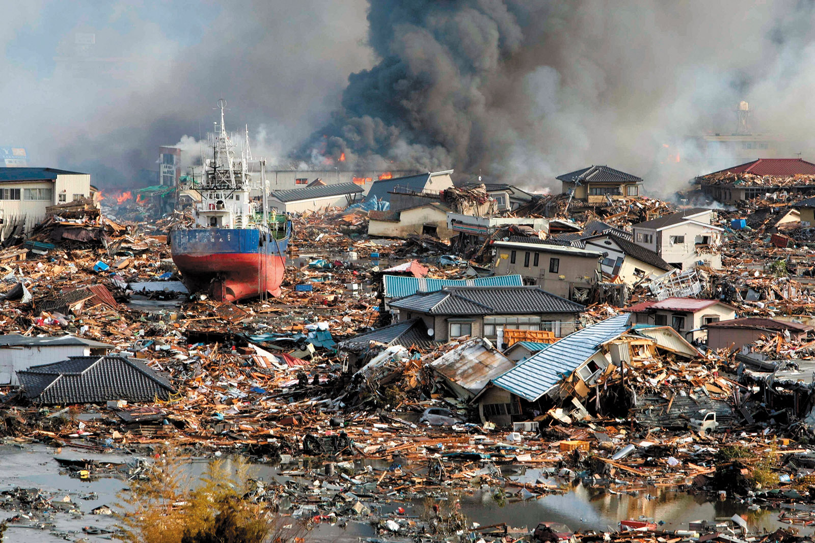 A destroyed section of the Japanese coastal city of Kesennuma, in Miyagi Prefecture, the day after the Tohoku earthquake and tsunami, March 2011