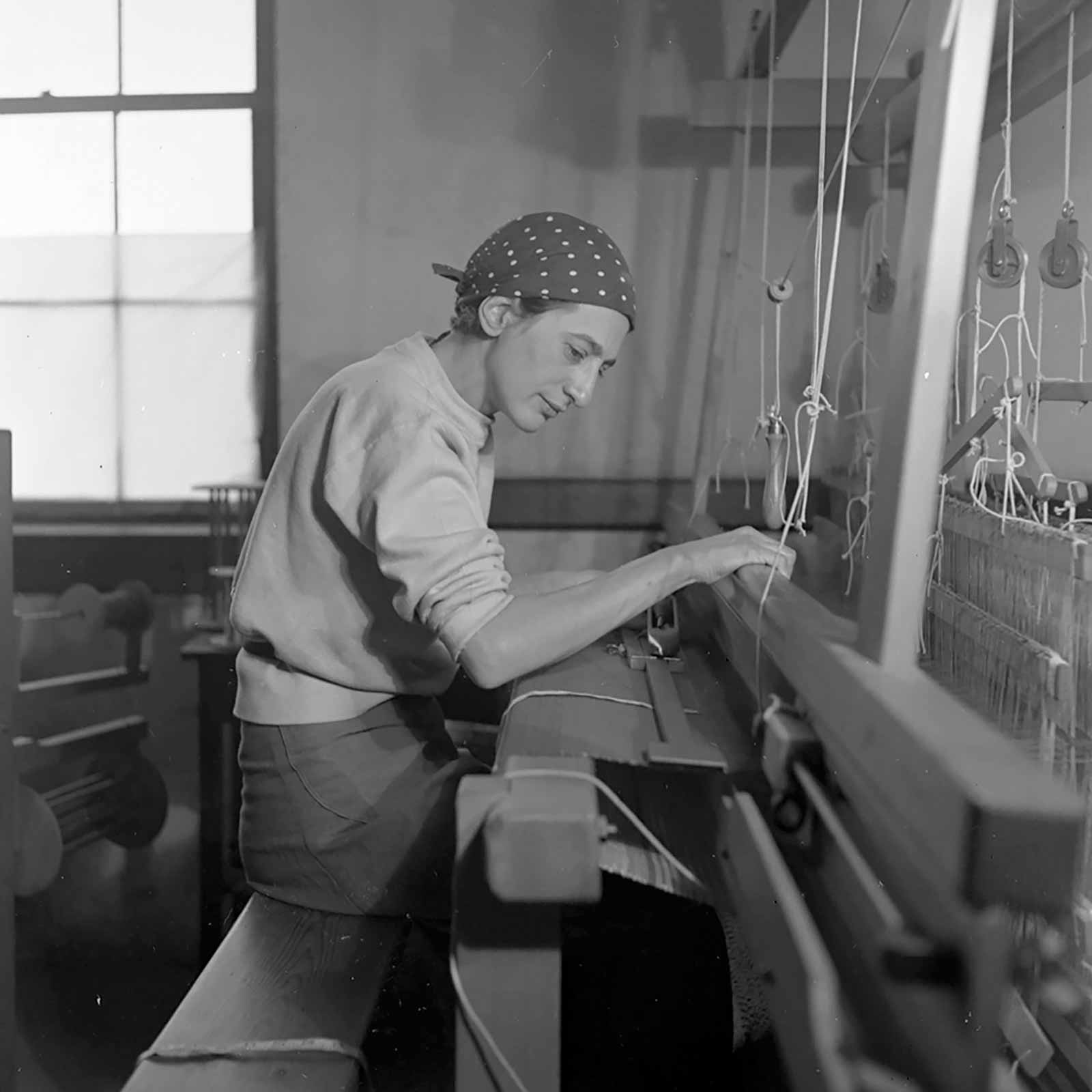 Photograph by Helen M. Post of Anni Albers in her weaving studio at Black Mountain College, 1937