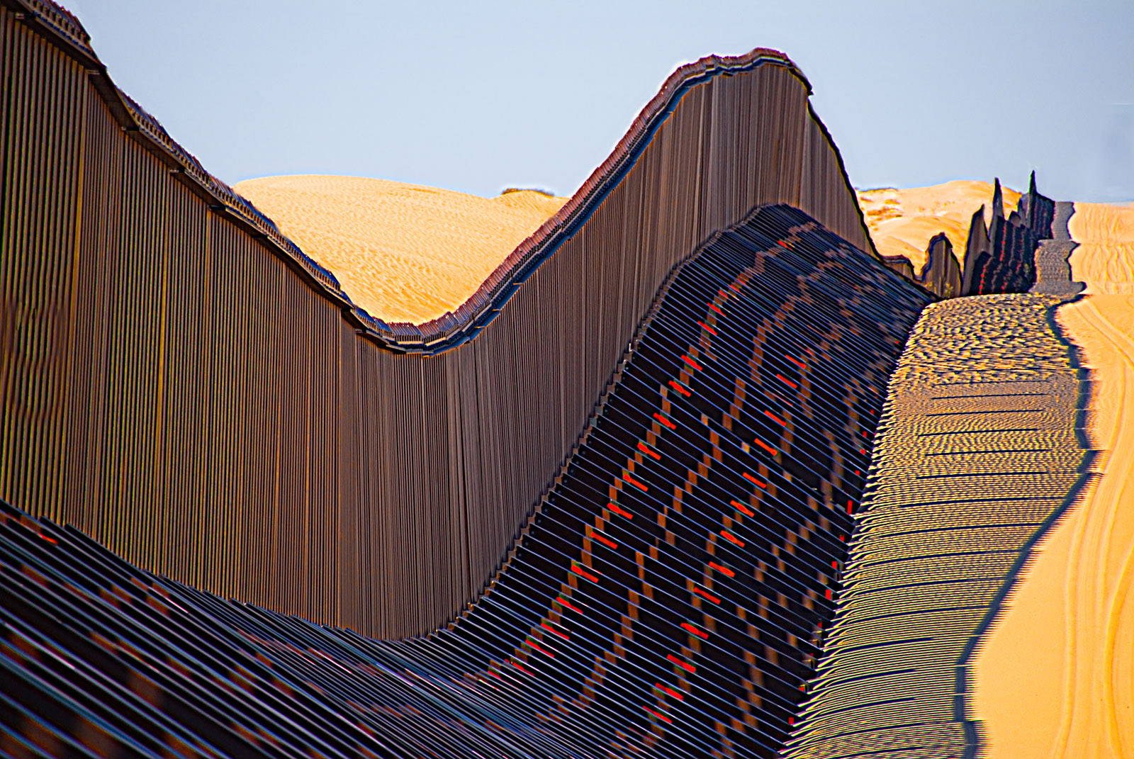 A high-tech adjustable section of the US-Mexico border fence running through the Algodones dunes in California, January 2018