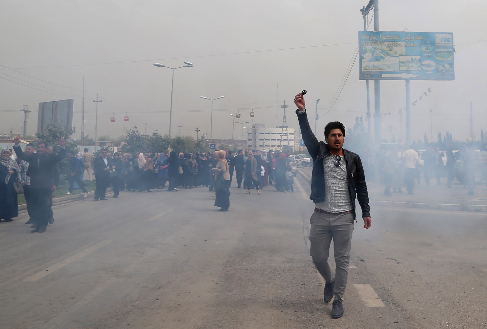 Teargas filling the air as Kurdish government police tried to disperse a protest of civil servants in Erbil, Iraq, March 25, 2018