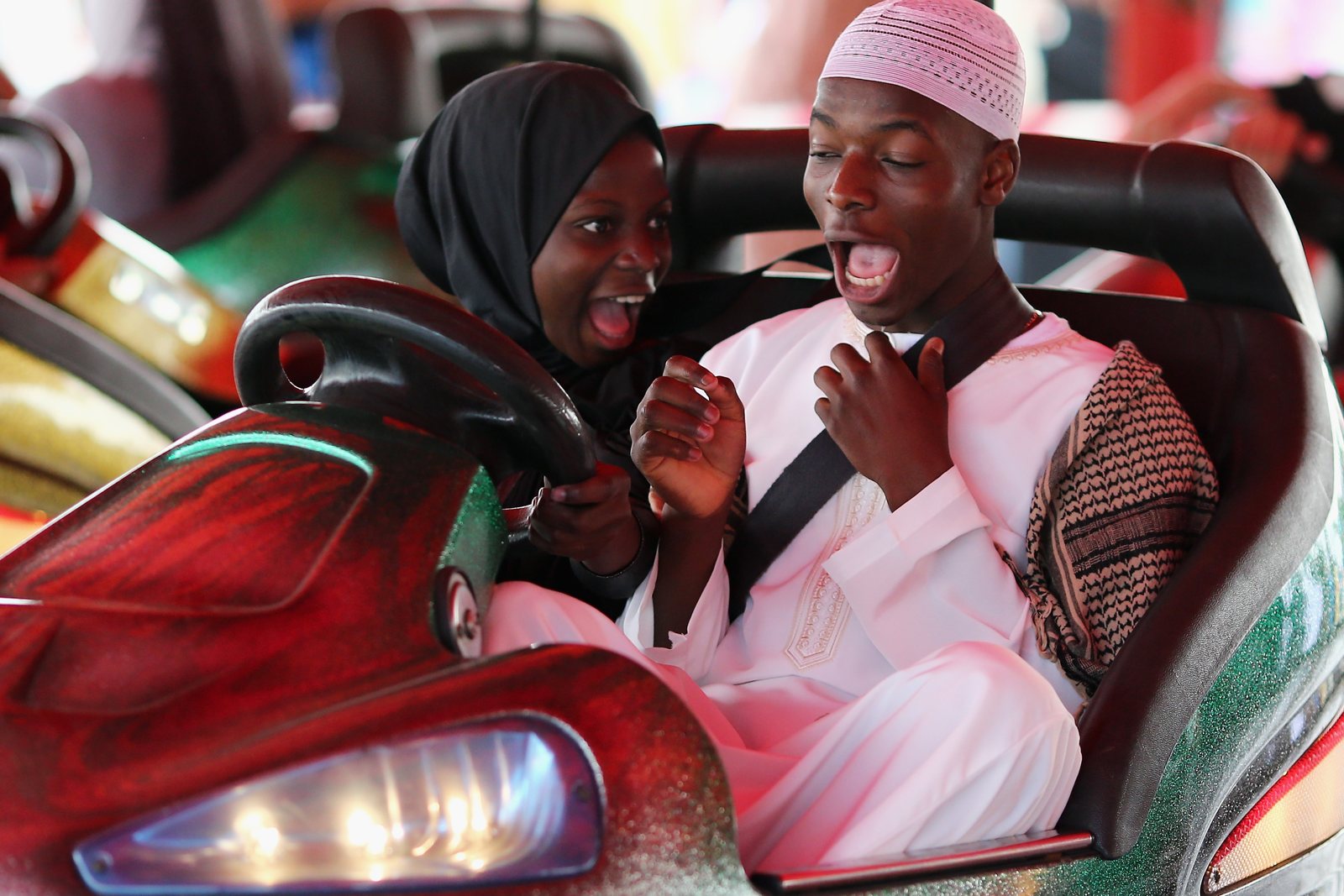 Visitors at an amusement park in London during an Eid celebration, July 2014
