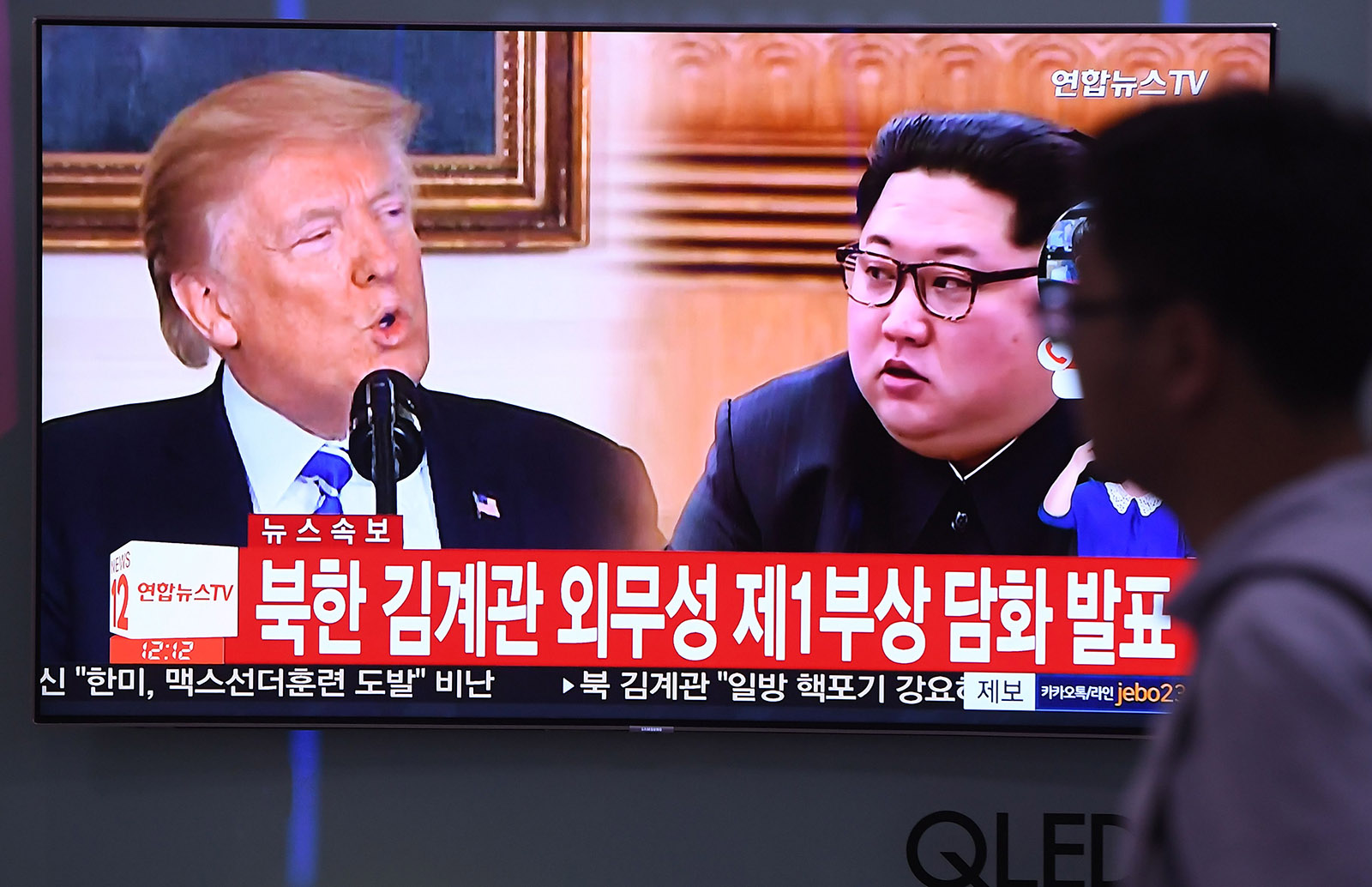 A railway station TV screen showing US President Donald Trump and North Korean leader Kim Jong-un, Seoul, South Korea, May 16, 2018