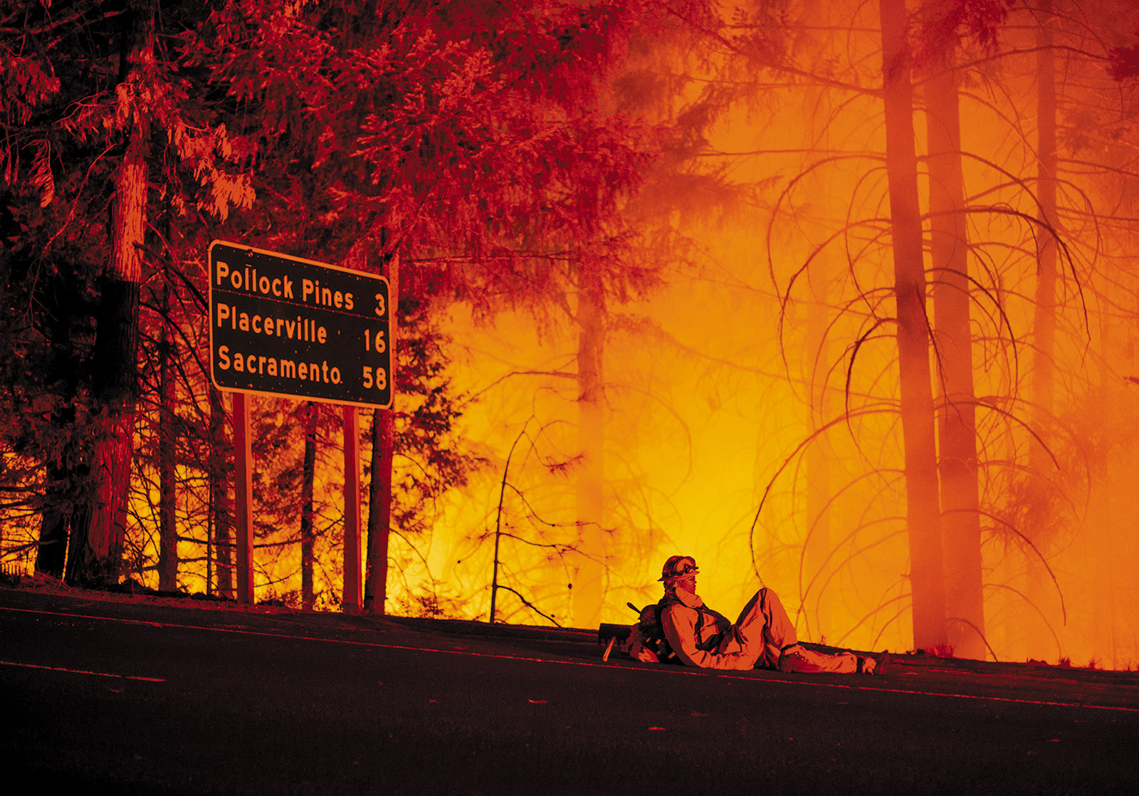 A firefighter taking a break from battling the King Fire, Fresh Pond, California, September 2014