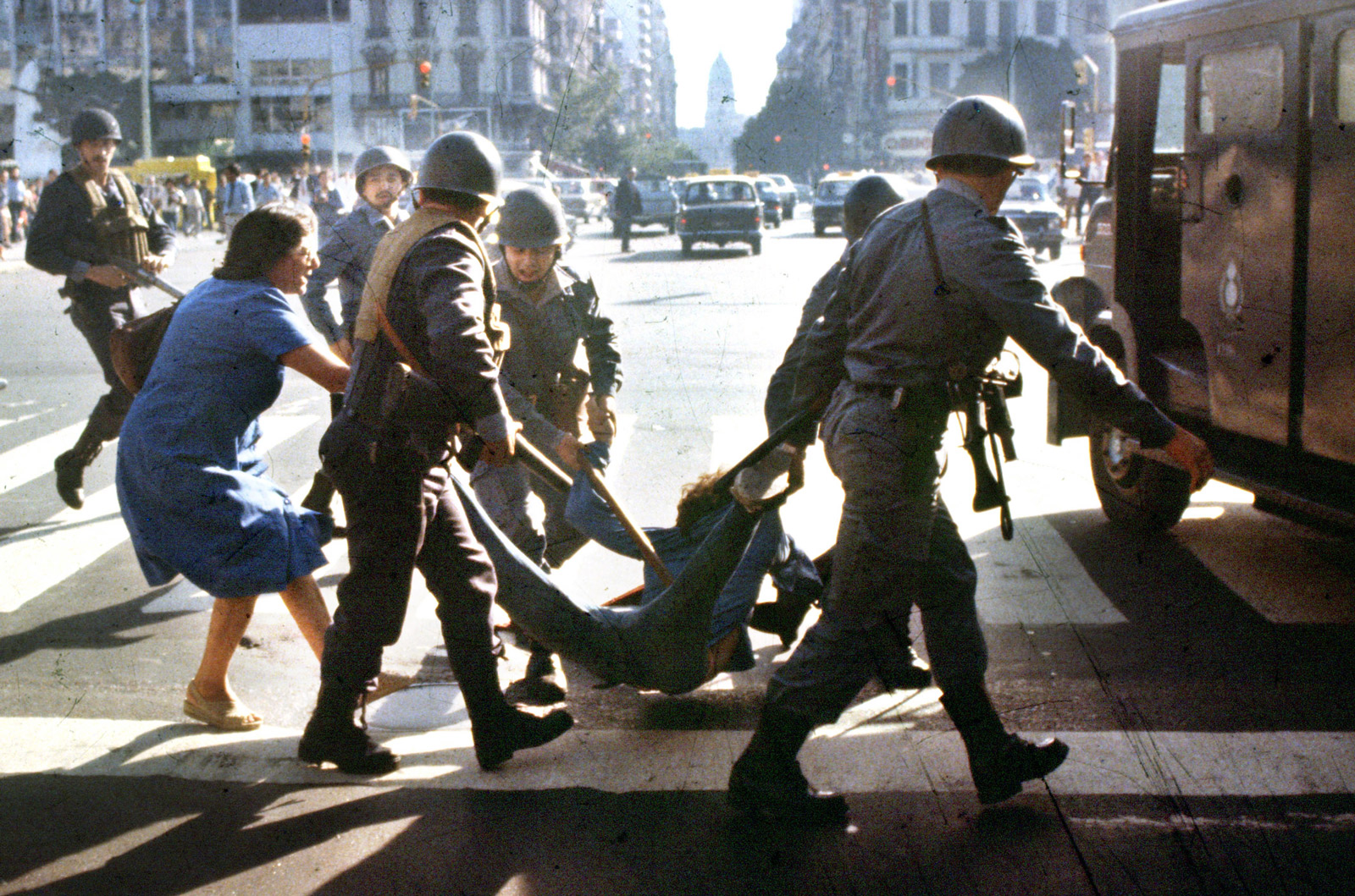 A woman trying to prevent the detention of a young man arrested by police at a protest rally against Argentina’s military dictatorship, Buenos Aires, March 30, 1982