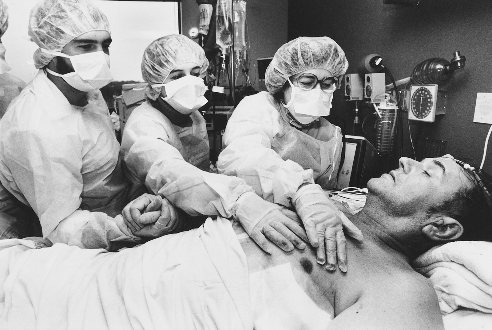 A patient’s family feeling the beat of an artificial heart after surgery at Humana Hospital-Audubon, Louisville, Kentucky, 1984