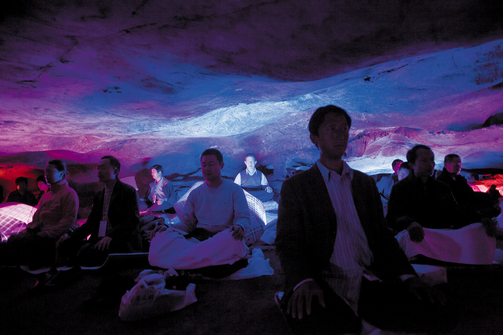 Daoist practitioners meditating in a cave in Jinhua, Zhejiang province, China, 2011