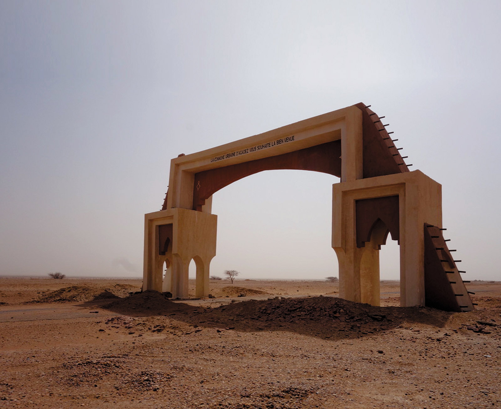 Agadez, Niger, 2018; the French inscription on the gate reads, ‘The city of Agadez welcomes you’