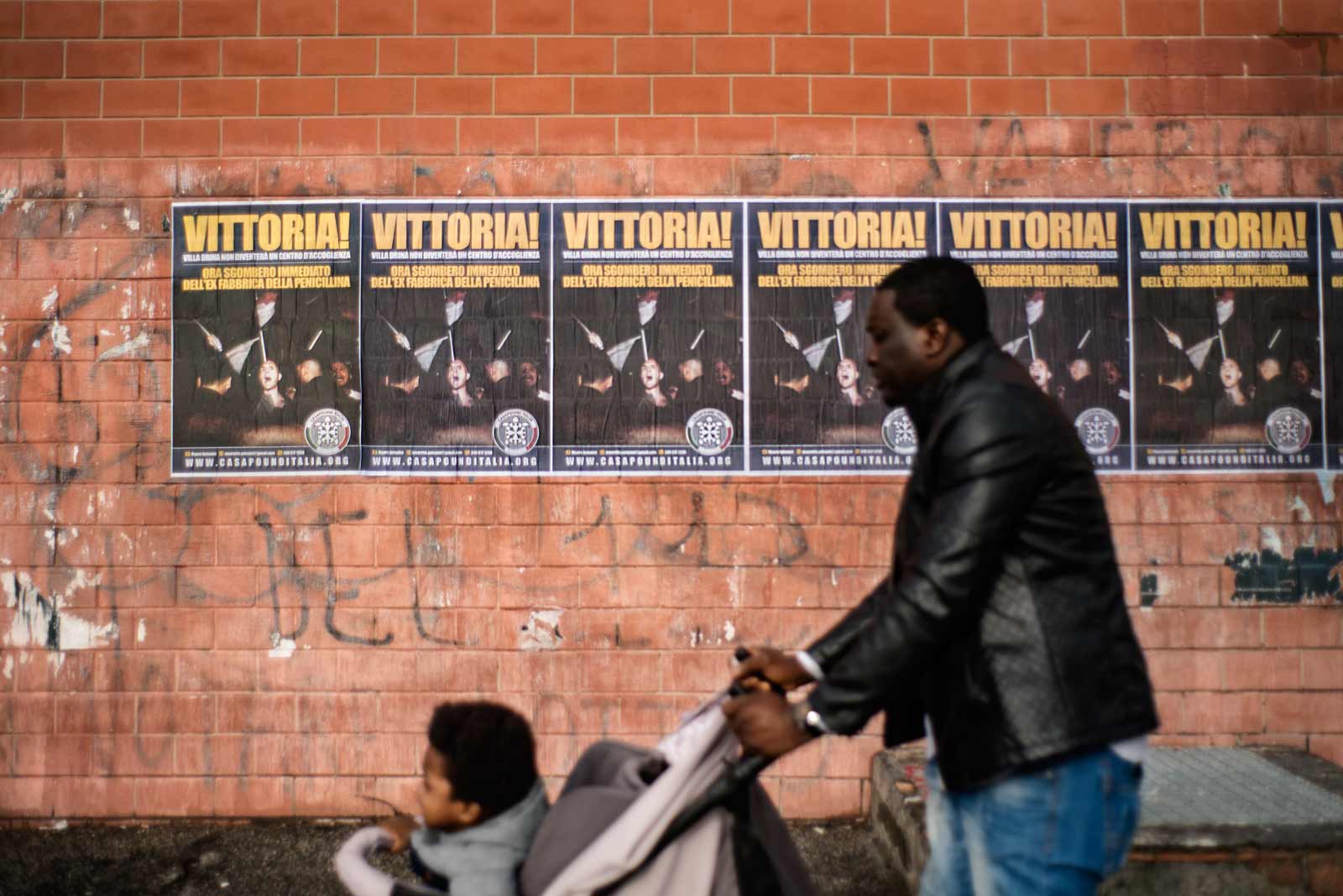 Posters by the fascist political party CasaPound calling for the eviction of the migrants and refugees living inside a former penicillin factory, Rome, November 26, 2018