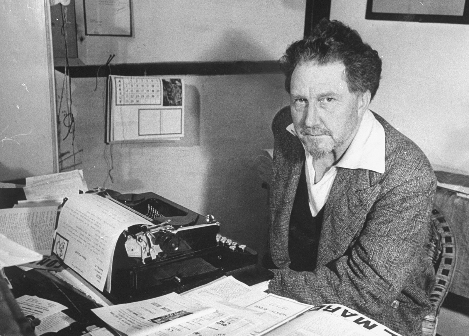 Ezra Pound composing pro-fascist commentaries on stationary emblazoned with Mussolini’s motto “Liberty Is a Duty, Not a Right,” Italy, 1940  