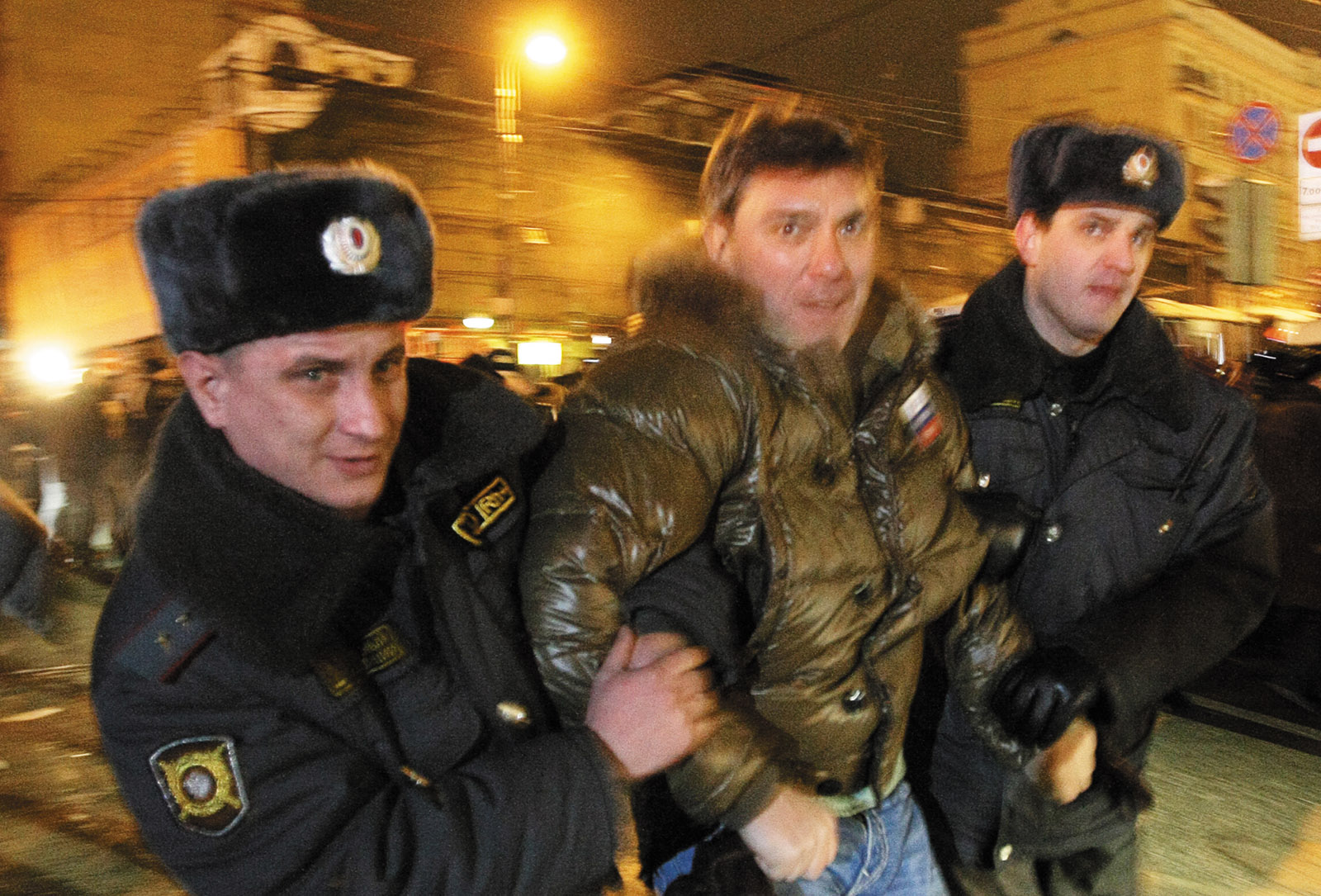 Police officers detaining opposition leader Boris Nemtsov during a rally in central Moscow, January 2010