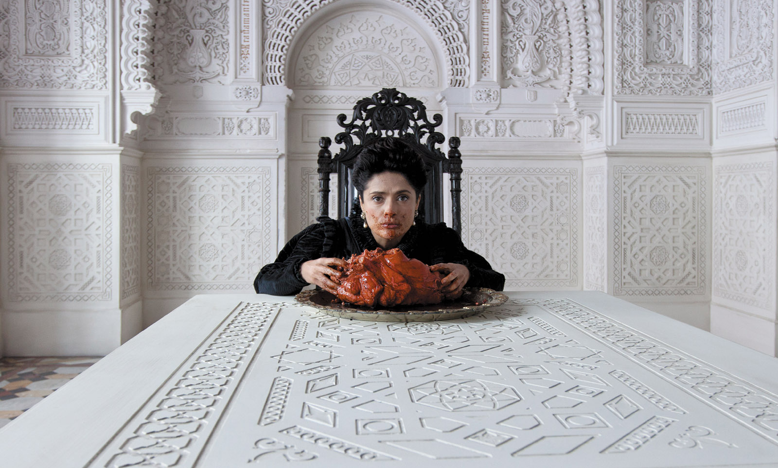 Salma Hayek as a queen eating the heart of a sea dragon in Matteo Garrone’s film Tale of Tales (2015), adapted from a set of stories by Giambattista Basile